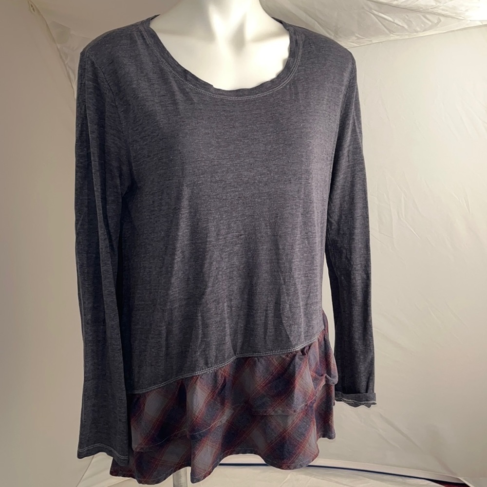 Dylan gray top with contrast plaid ruffle embellishment at bottom hem